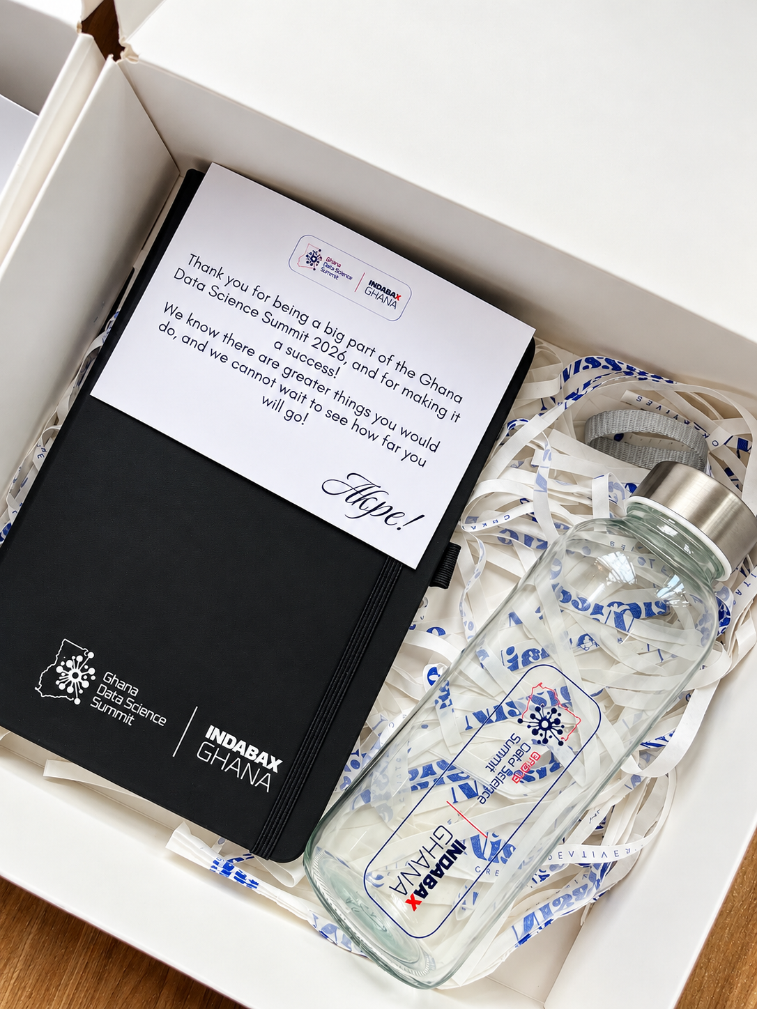 Customized journal and bottle with company logo