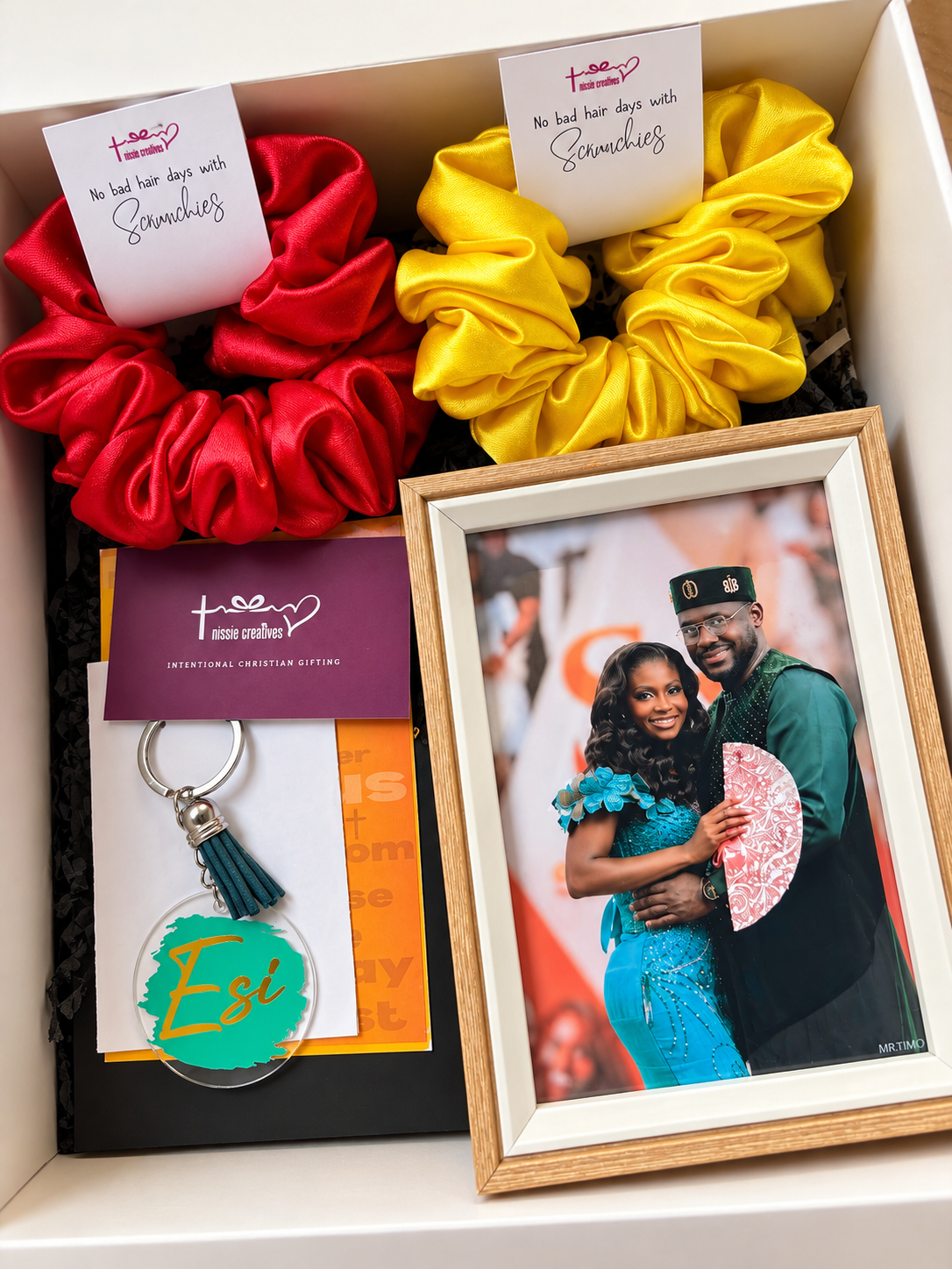 box with a journal, tote bag, frame, keychain and 2 scrunchies with the name Esi in green