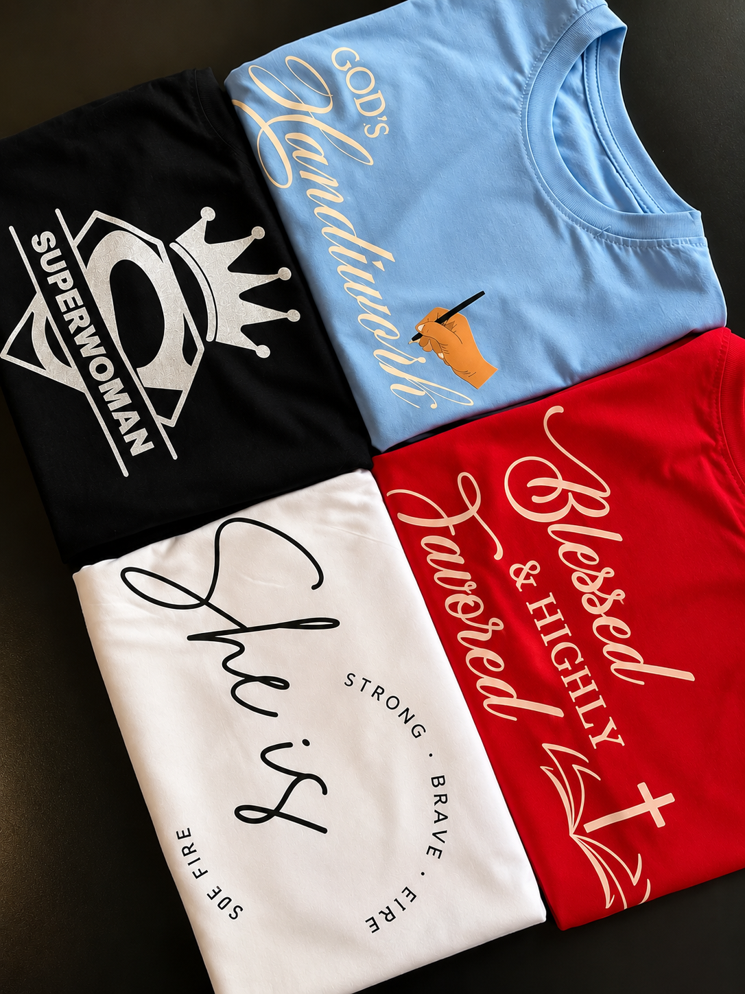 Four t shirts in blue, white, black and red customized