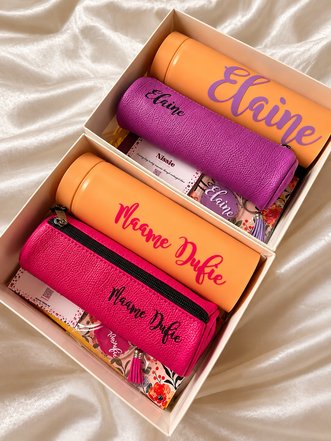 package with a journal, tumbler, pencil case and keychain