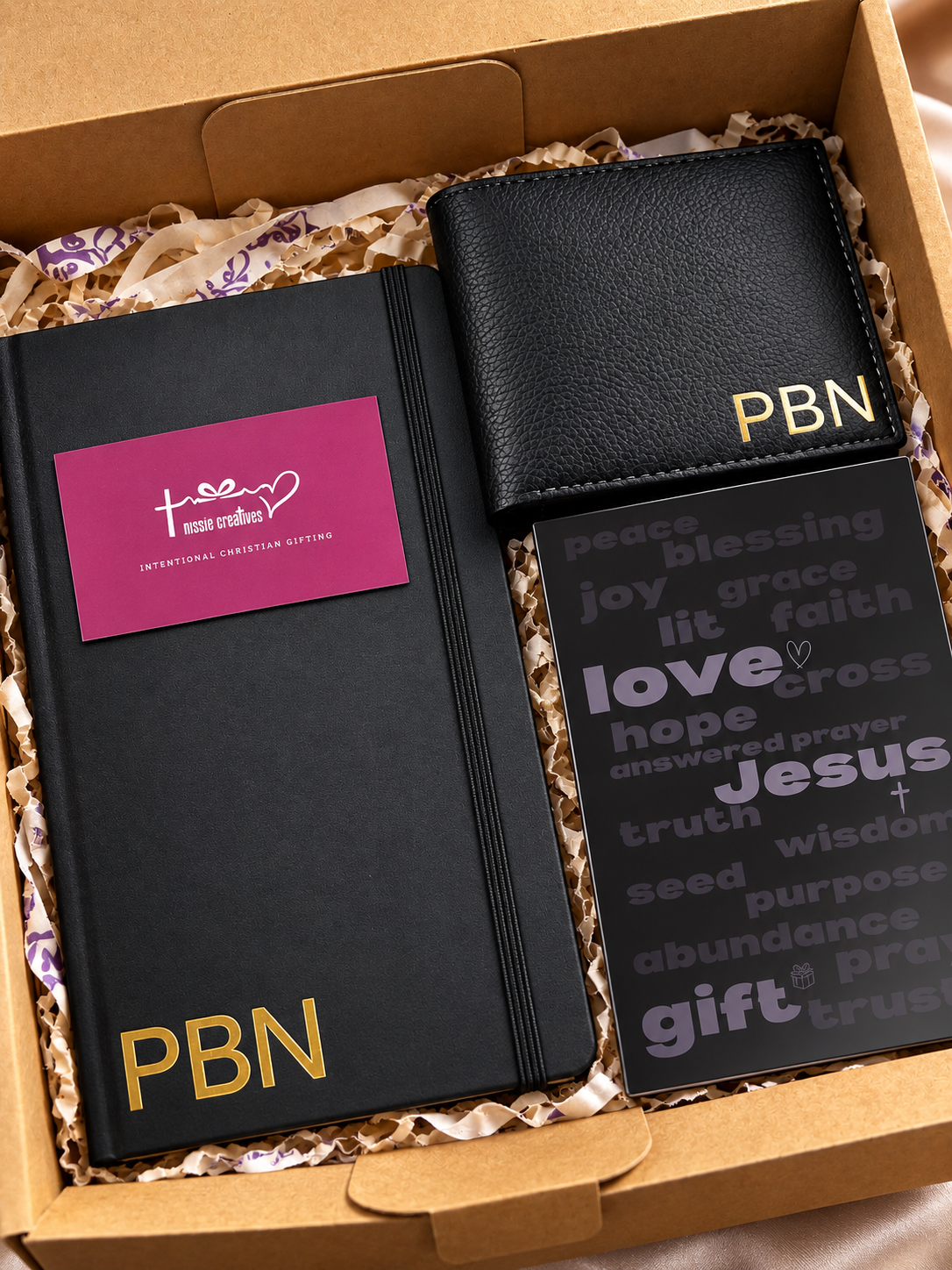 A customized journal and wallet in black with PBN